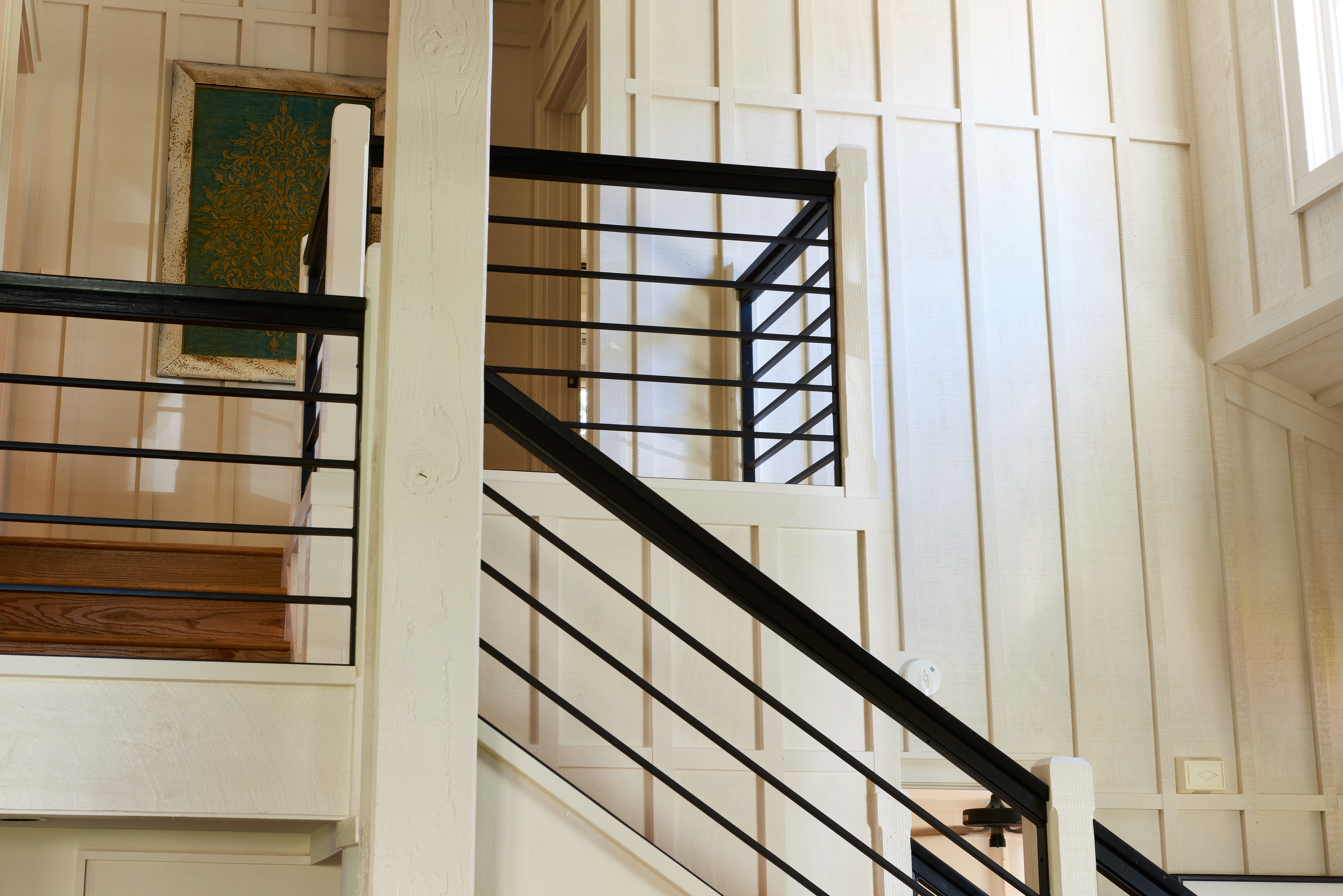 modern staircase black metal railing white wood