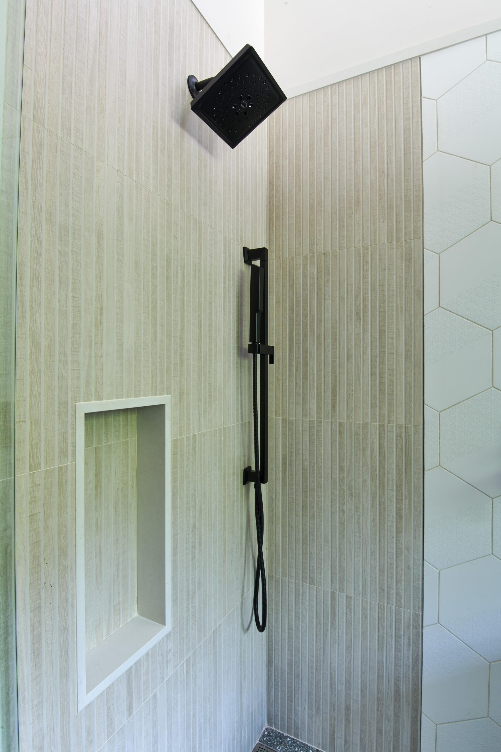 a_bathroom_with_a_shower_and_a_mirror_brdb_highlands_nc_guest_bath_shower_