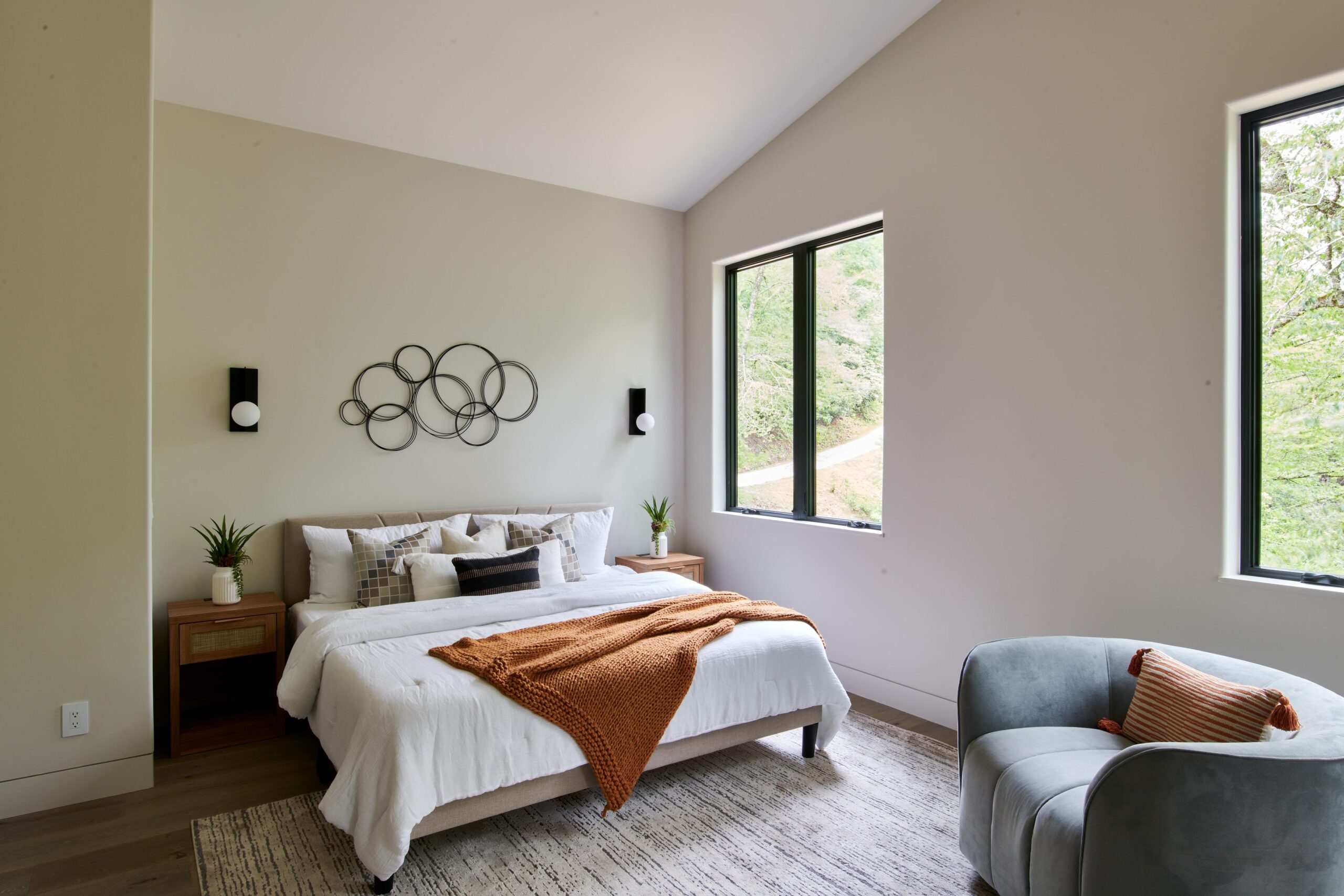 a_bedroom_with_a_bed_and_a_chair_brdb_highlands_nc_guest_bath_2nd_master_bedroom_