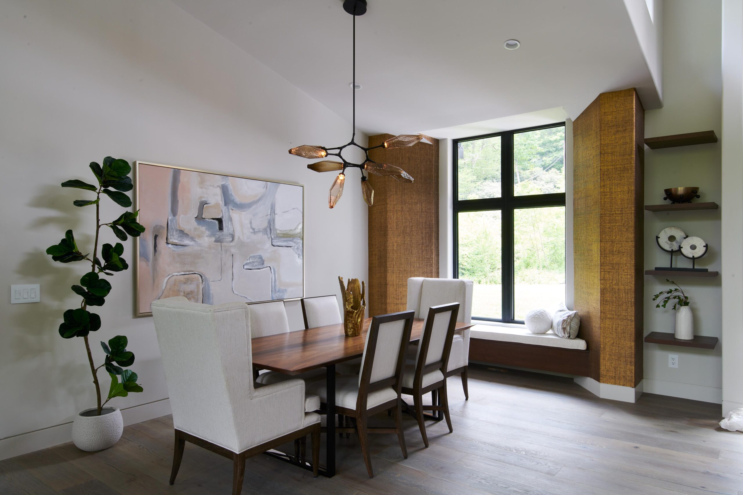 a_dining_room_with_a_large_painting_on_the_wall_brdb_highlands_nc_living_room_