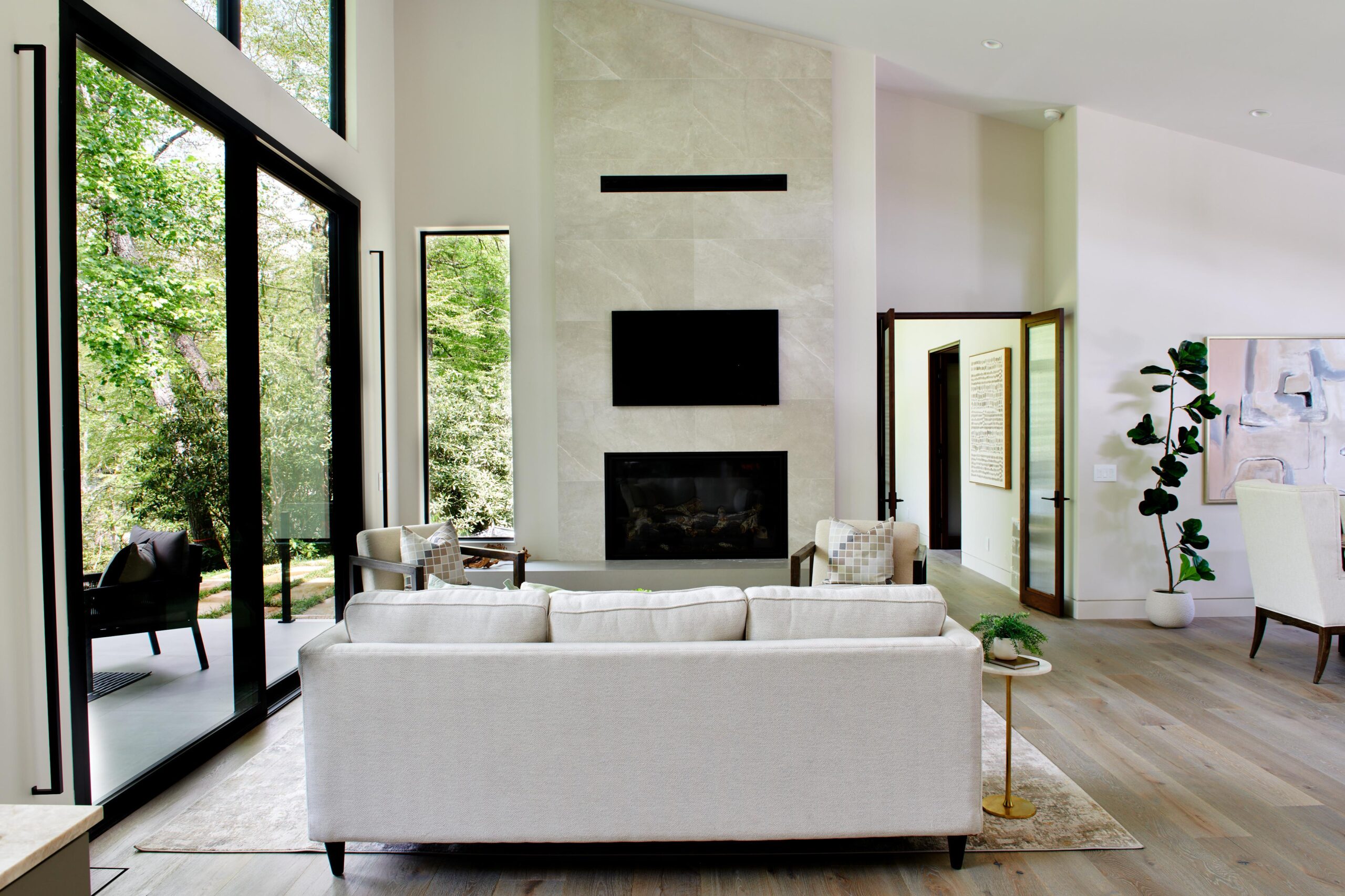 a_living_room_with_a_white_couch_and_a_fireplace_brdb_highlands_bedroom_living_room_